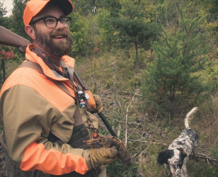 Artist Jay Dowd with an English setter hunting woodcock.