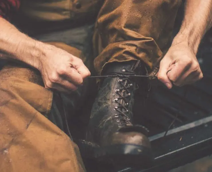 tying a pair of filson x danner grouse boots