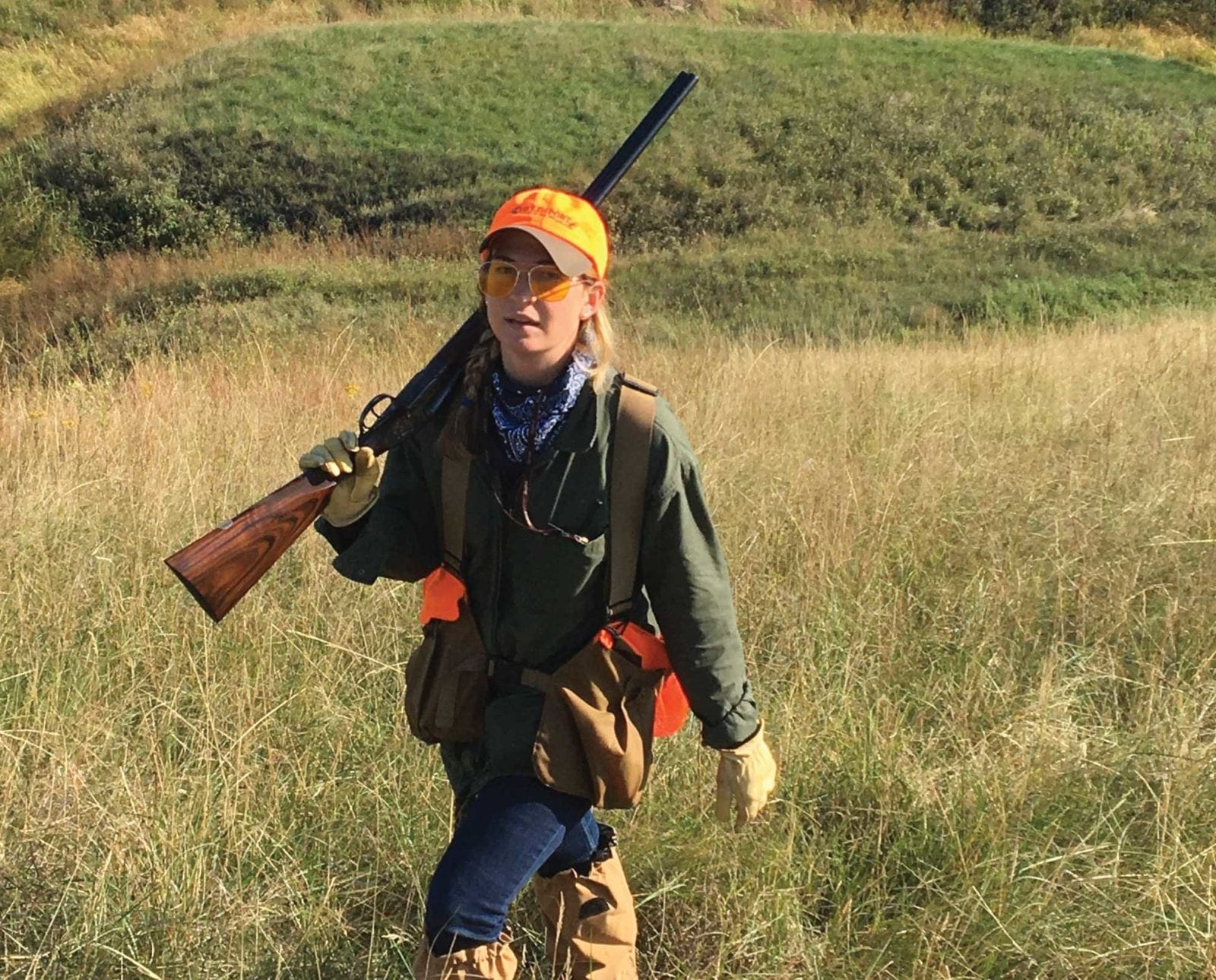 A woman bird hunting out west with an Arrietta shotgun.
