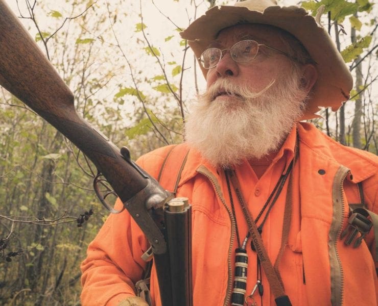 An upland hunting guide with double barrel shotgun