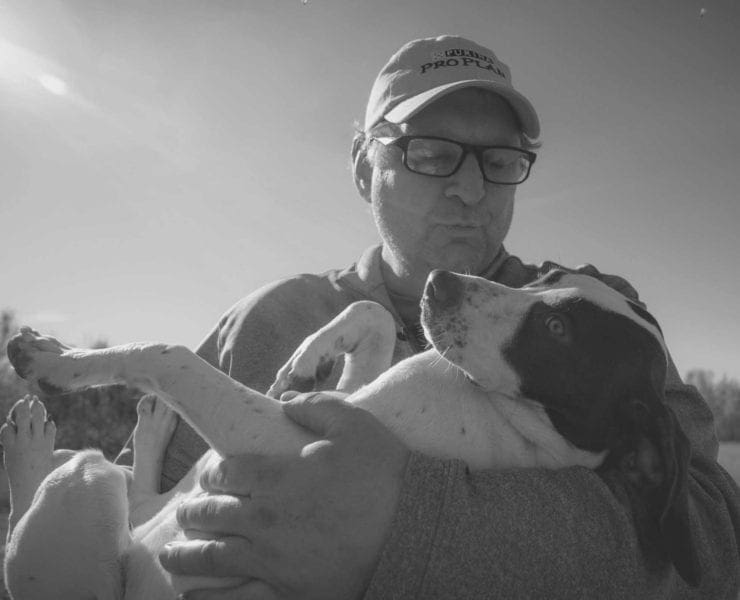 Jerry Havel, owner of Pineridge Grouse Camp, holding an English pointer.