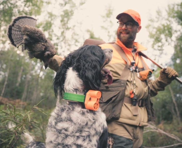 Jay Dowd with one of his English setters and a ruffed grouse.