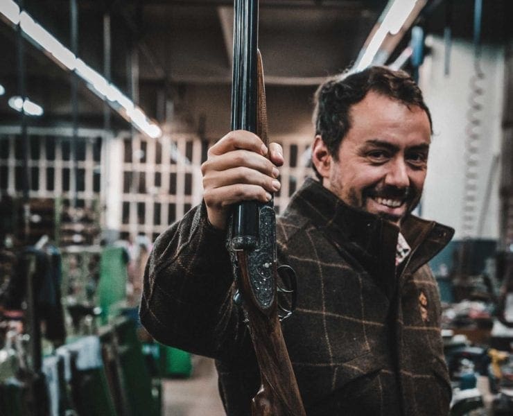 Owner of AYA Alex Aranzábal holds up a shotgun in the factory in Eibar Spain.
