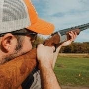 A hunter brakes clays with a Stevens 555E