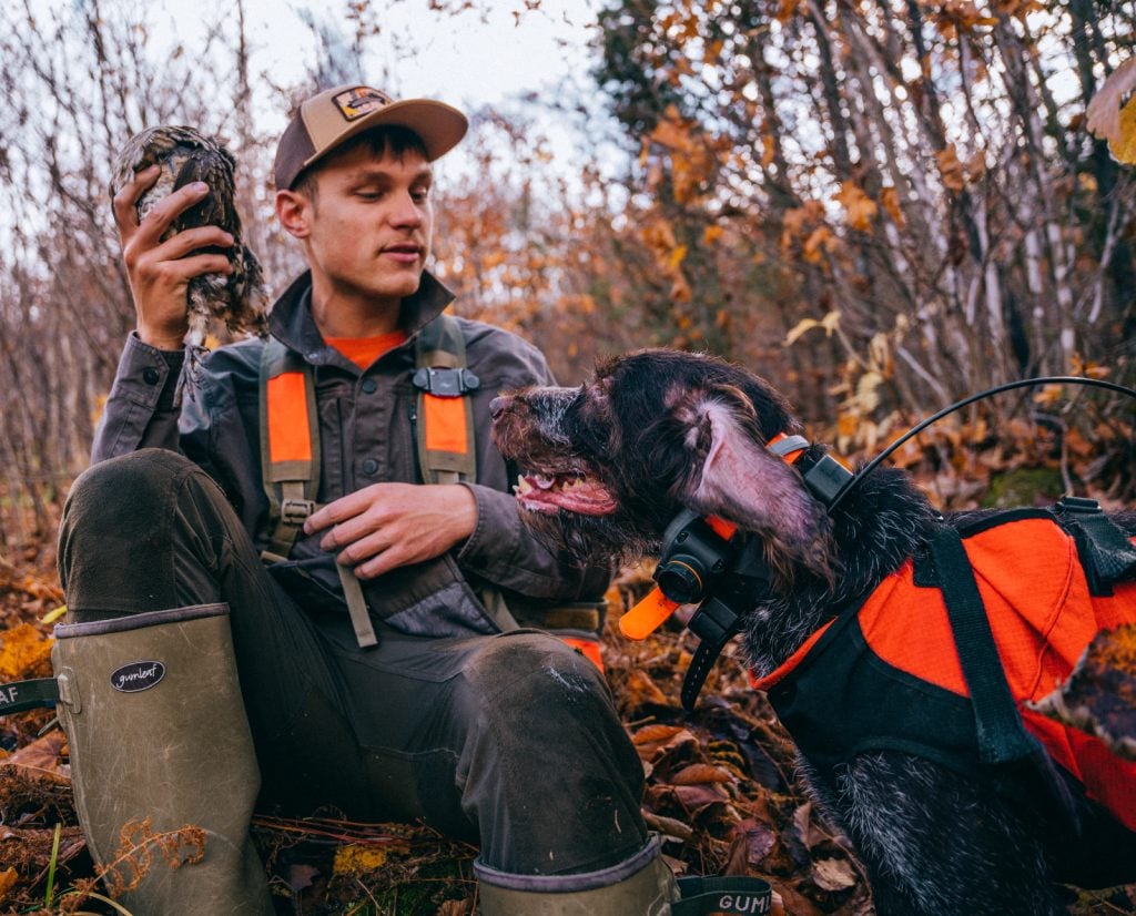 A ruffed grouse hunter and bird dog. 