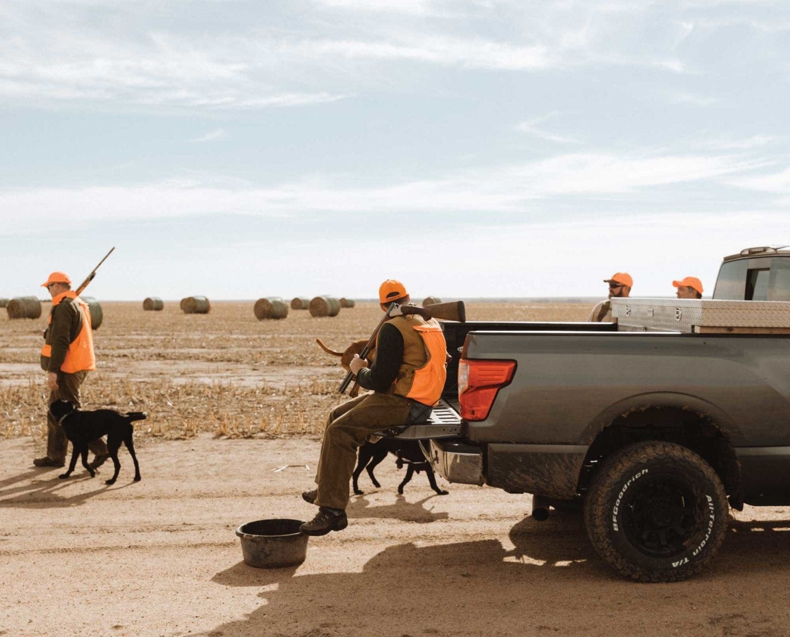 A group of bird hunters on a road trip for pheasant hunting.