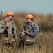 two bird hunters with prairie chickens