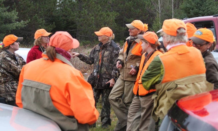 A group of women plan a days hunt.