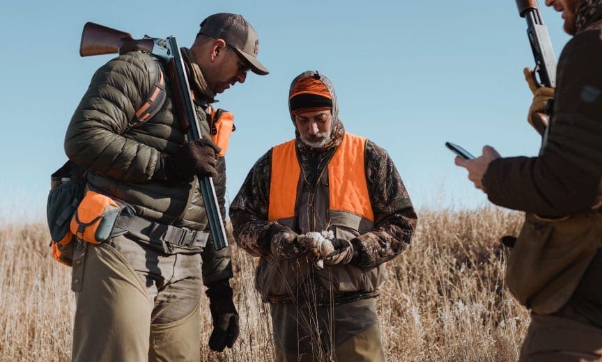 A hunter uses social media to learn about hunting while in the field. 