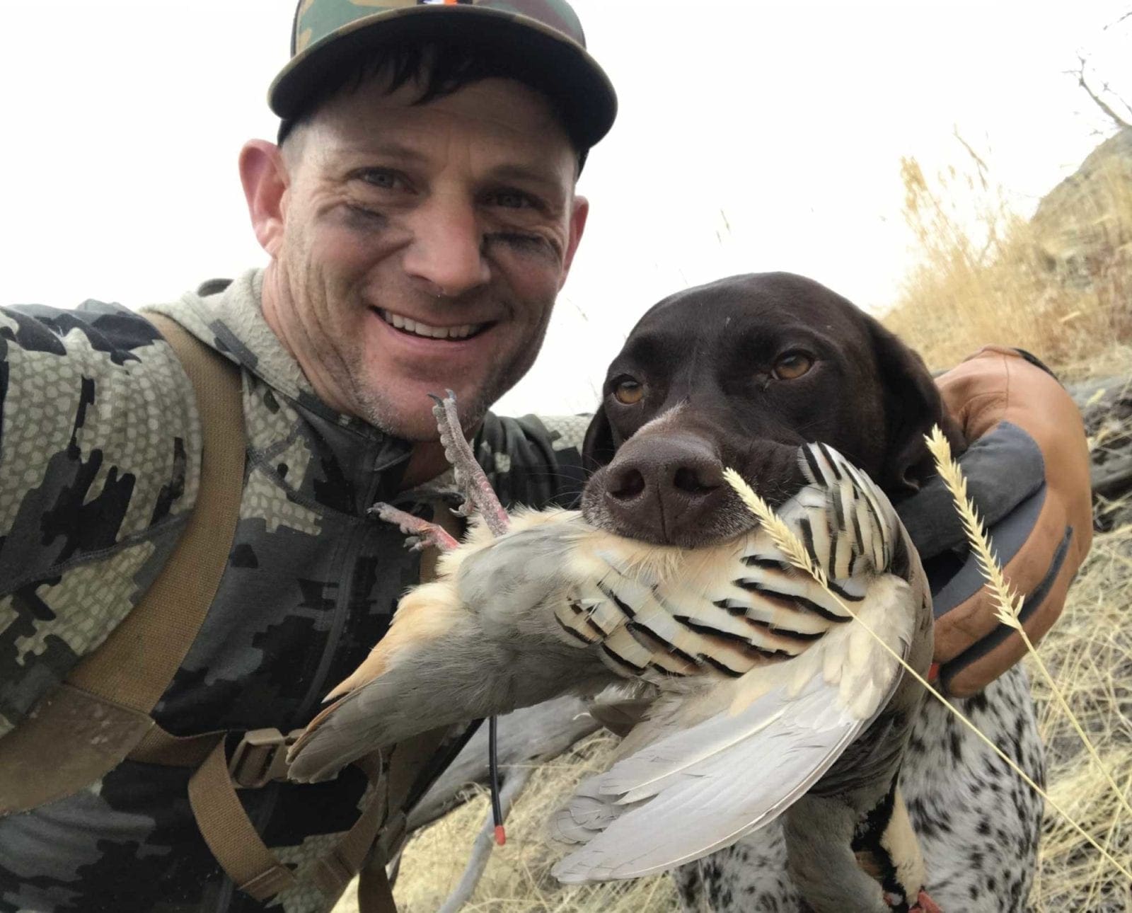Derek Allen chukar hunting with his dog