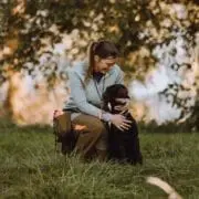 A bird hunter with her hunting dog