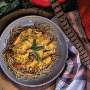 Pumpkin pheasant sage pasta on a fall themed plate