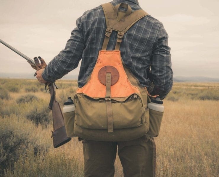 A hunter wearing a Wing Works upland strap vest
