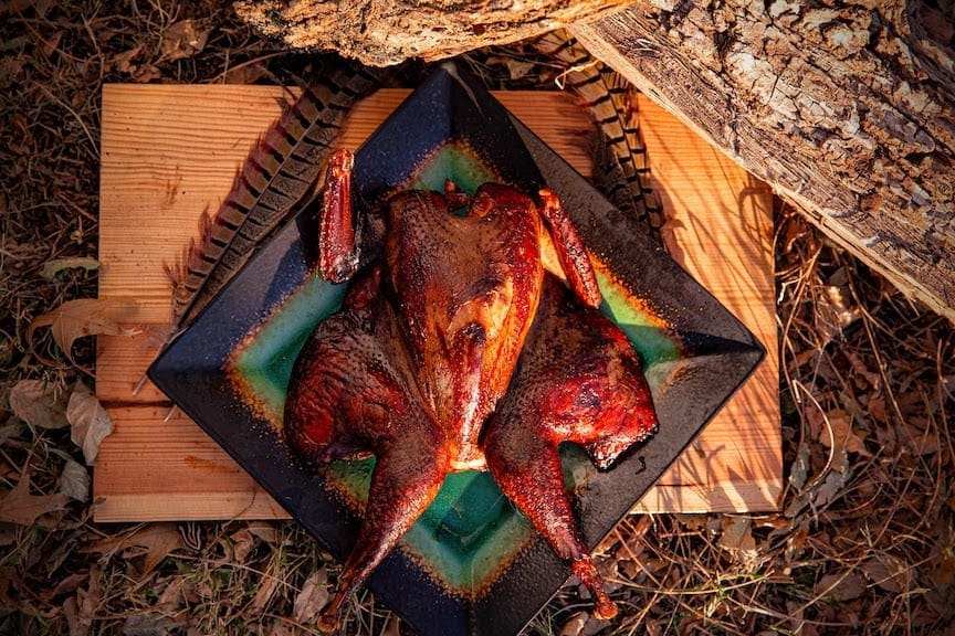 Maple smoked pheasant on a fall-themed plate