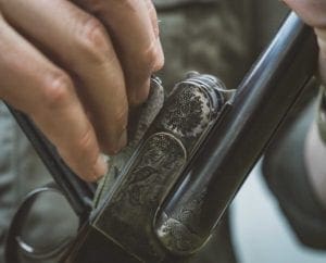 Removing one of the internal hammers on a boxlock shotgun