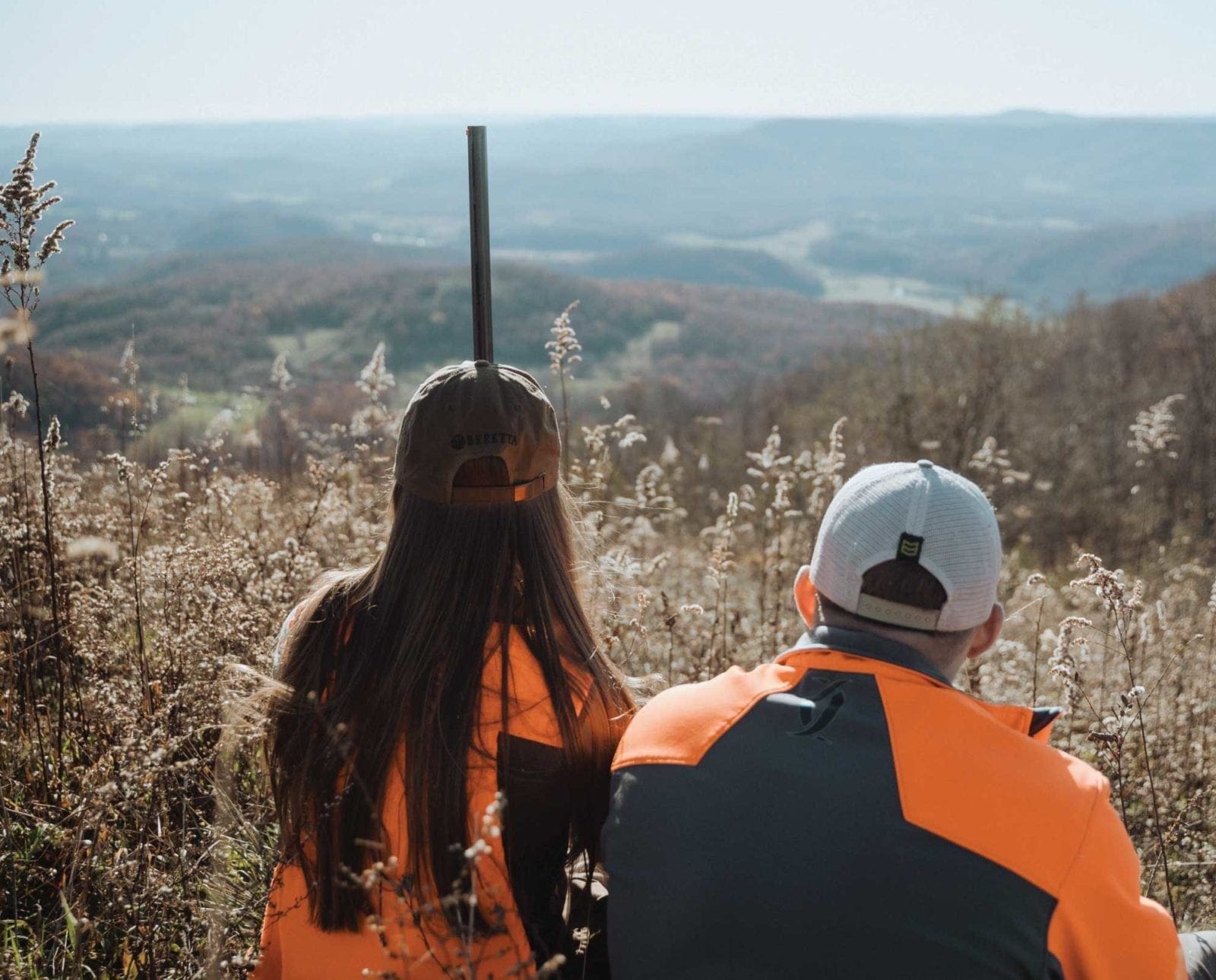 Amanda and her husband overlook the West Virginia mountains