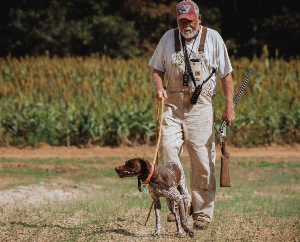 Mo Lindley handles a German Shorthaired Pointer while training. 