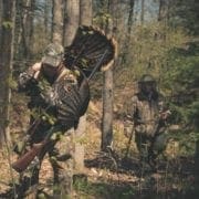 Turkey hunters in the spring woods after shooting a turkey