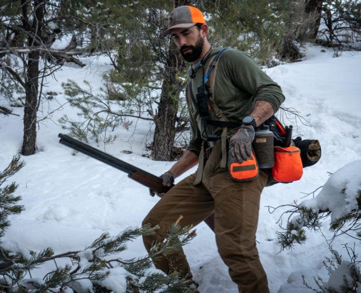 Jason Hayes, a chukar hunter, makes his way down steep terrain