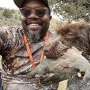 Eric Thompson, co-creator of Hardwired Outdoors hunting chukar with his dog.