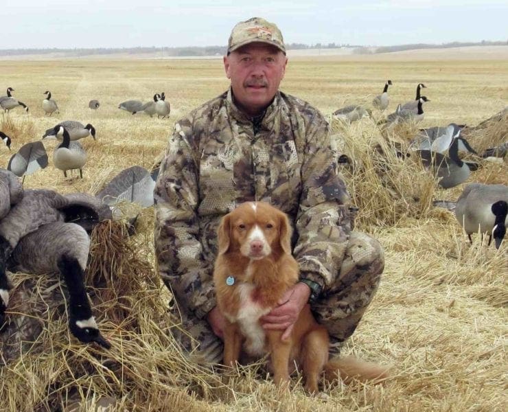 Grant St Germain with his duck tolling retriever on a waterfowl hunt.