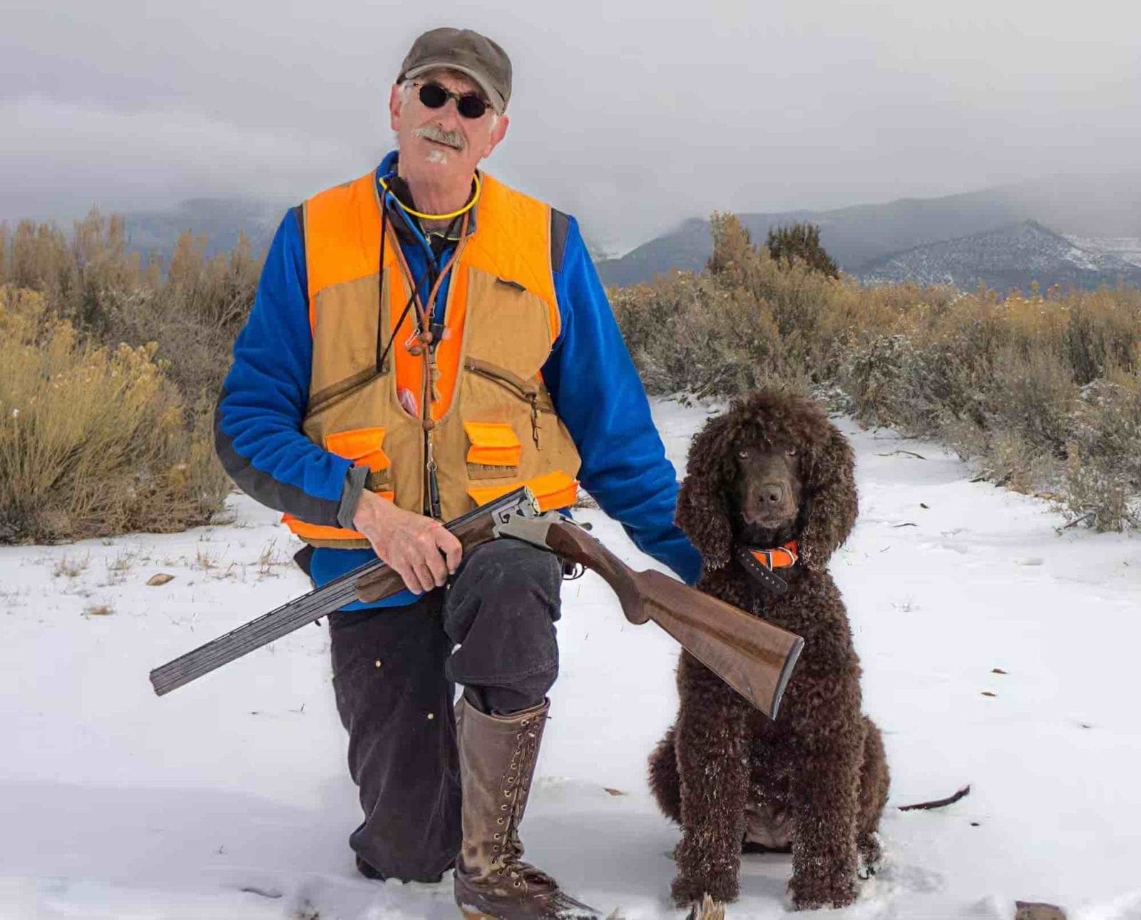 Russell Dodd and Irish Water Spaniel pheasant hunting in the snow