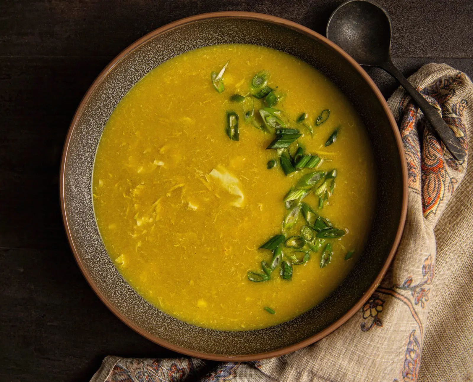 Upland bird egg drop soup sits on a table.