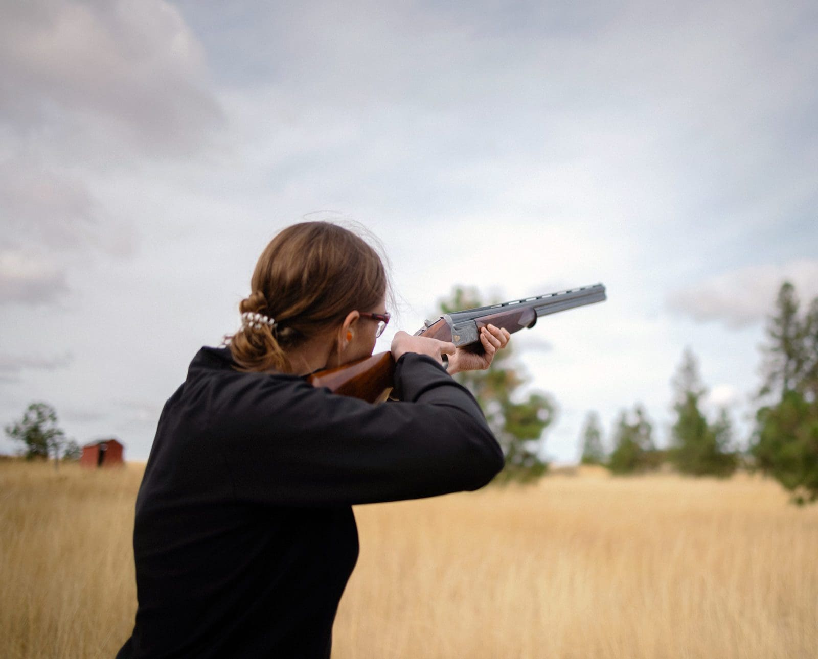Jennifer Wapenski shoots clays with her shotgun.