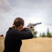Jennifer Wapenski shoots clays with her shotgun.