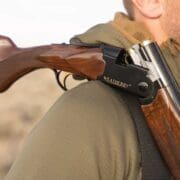A hunter carries a Weatherby Orion 20 gauge while bird hunting