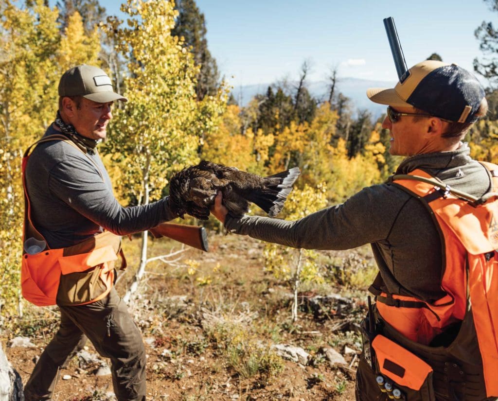 Two bird hunters in Colorado with a Dusky Grouse