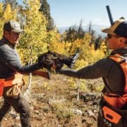 Two bird hunters in Colorado with a Dusky Grouse