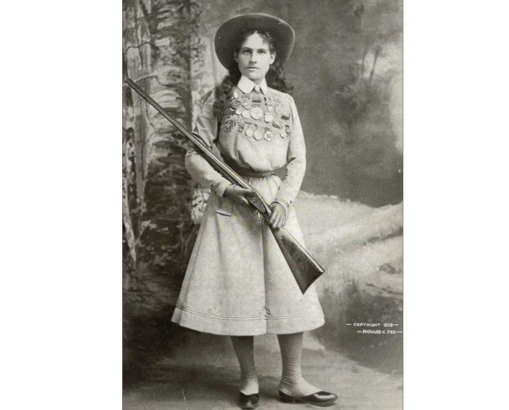 Annie Oakley with a side-by-side shotgun