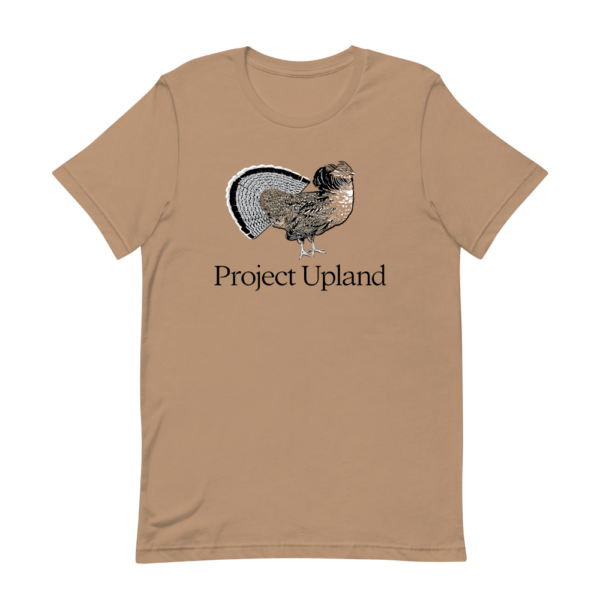 A fanning ruffed grouse on a Project Upland t-shirt in sand dune brown