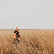 A Bird hunter walks grasslands in Nebraska.
