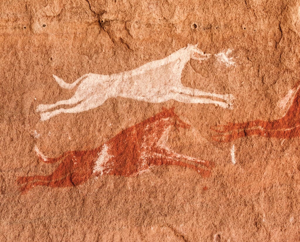 A cave painting of early hunting dogs