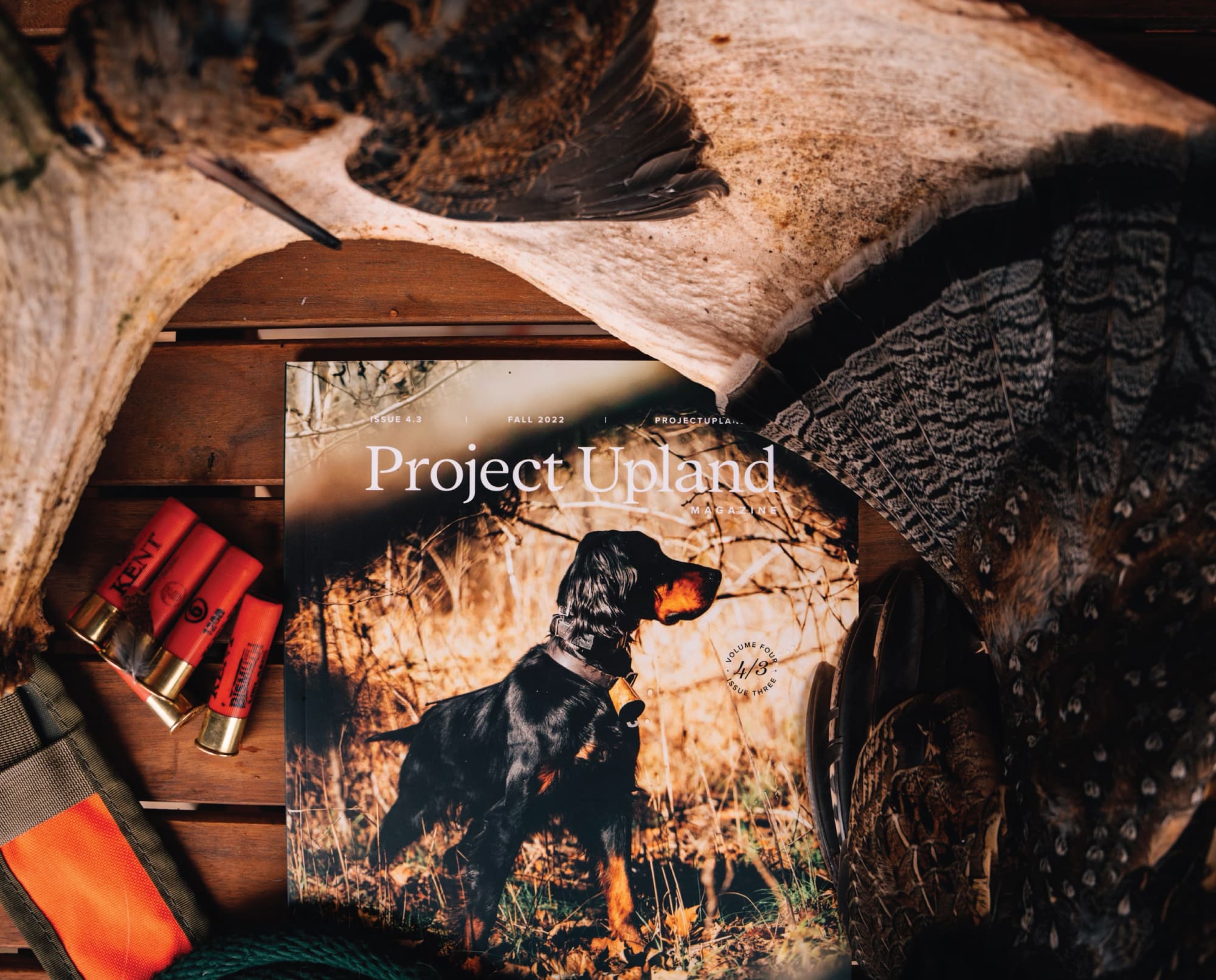 Project Upland Magazine with some bird hunting gear on a table