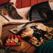 An issue of project upland magazine with some upland hunting gear and grouse