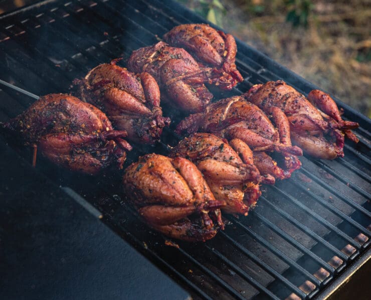 Quail perfectly finished on a smoked pellet grill.