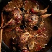 Hungarian partridges cooking in a tomato broth for cacciatore dish
