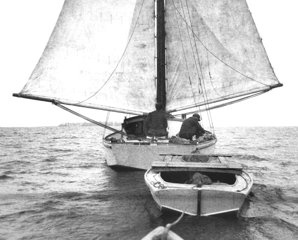 Lay boat on a downwind run, towing the lighter with sinkbox and tender.