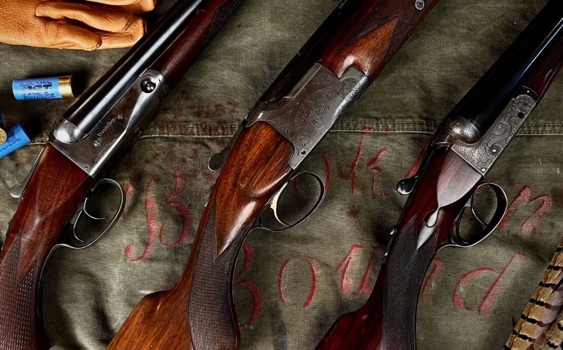 A collection of vintage shotguns used for hunting