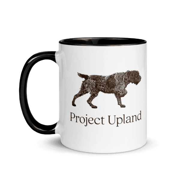 A coffee mug with a classic Wirehaired Pointing Griffon design on it.