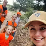 A mother shows her kids how to upland hunt.