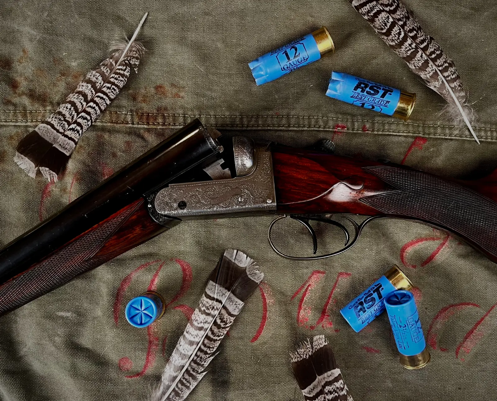 A selection of vintage shotgun ammo with a old classic shotgun