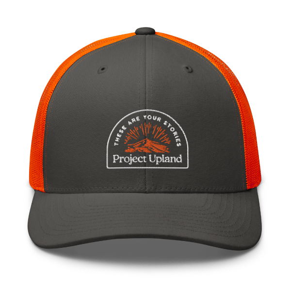 A blaze orange backed hat for bird hunting with the classic Project Upland logo.