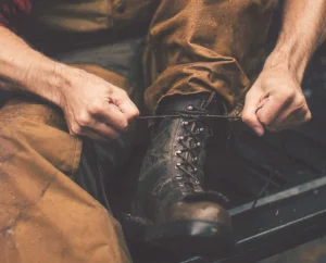 tying a pair of filson x danner grouse boots