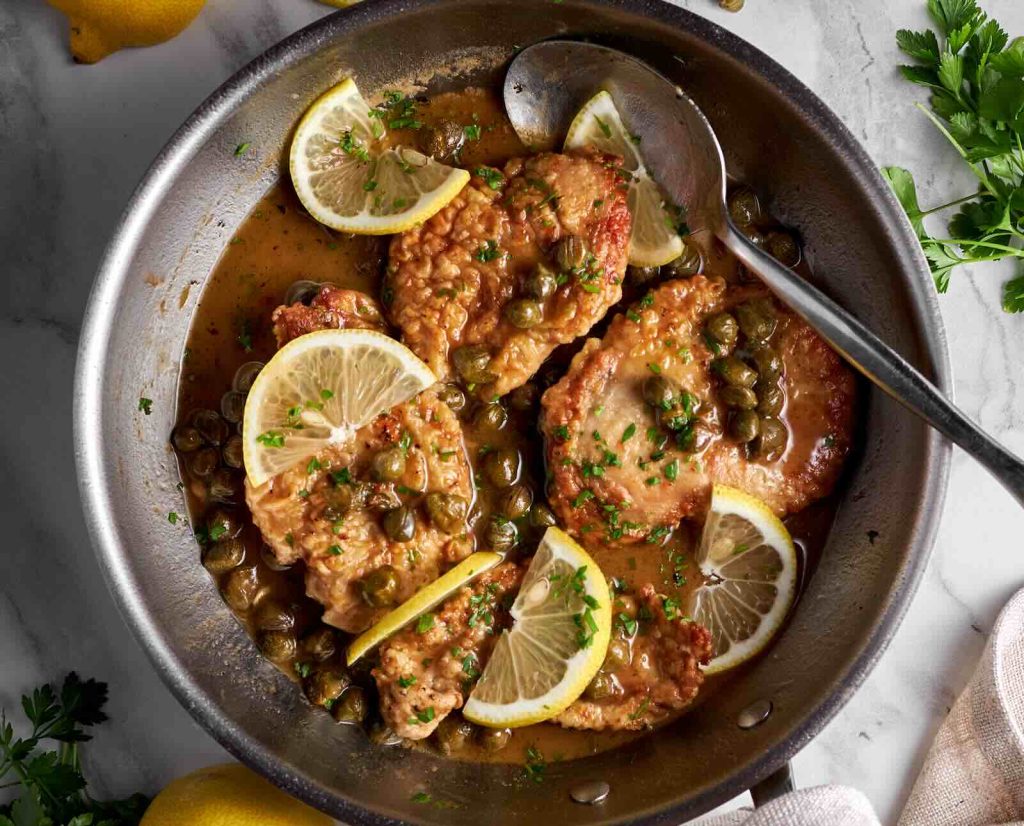 A serving dish of ruffed grouse piccata with lemon and capers