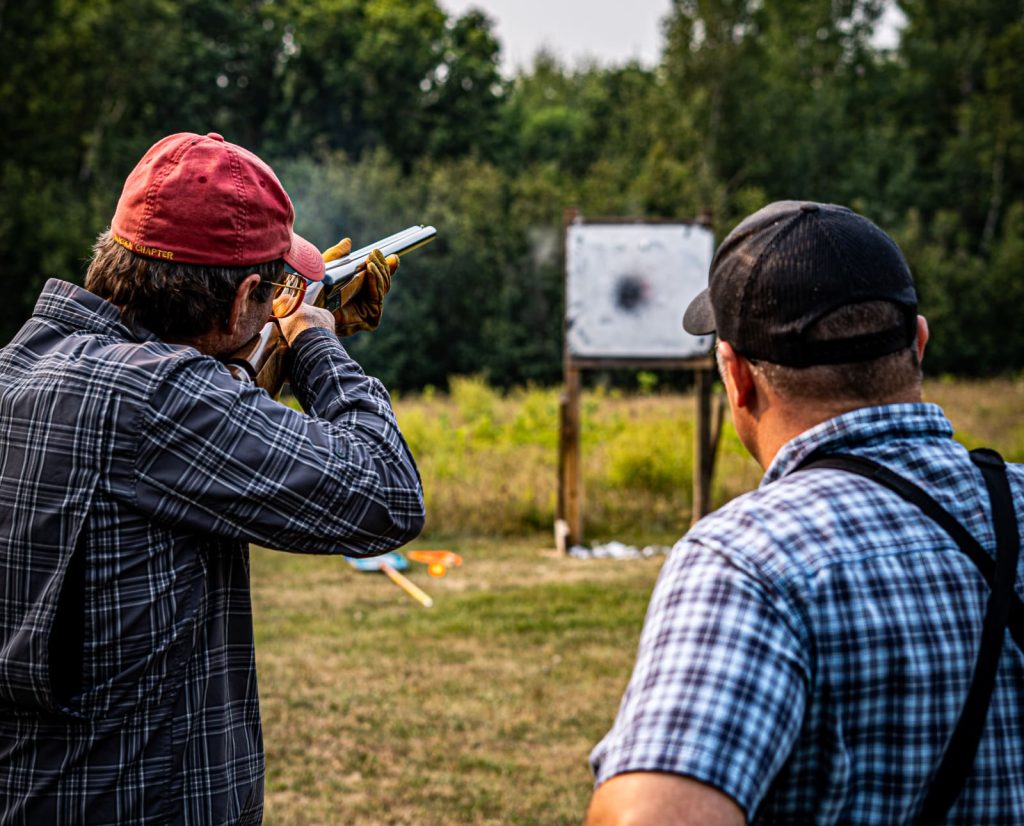 A client shoots at a patterning board as Del discovers his proper gun fit dimensions 