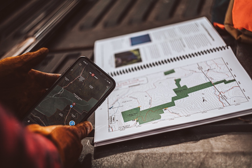 A hunter uses OnX maps to scout for hunting locations
